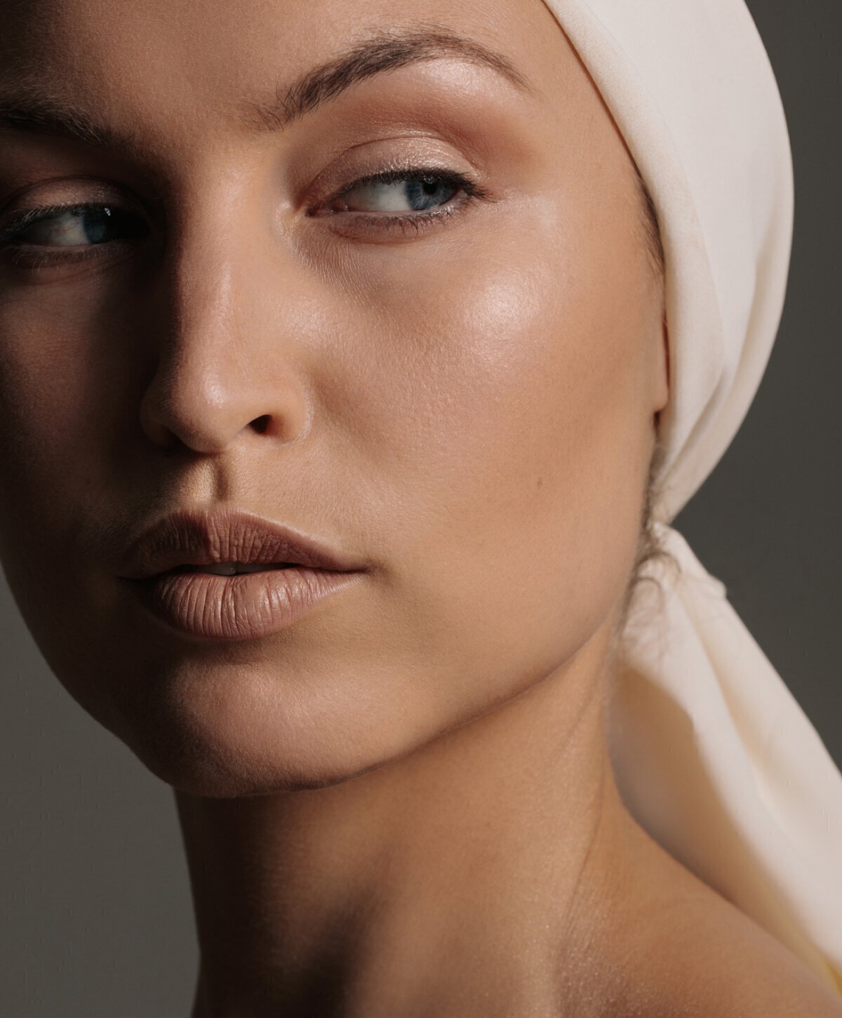Brooklyn facial lesion removal model with white head wrap