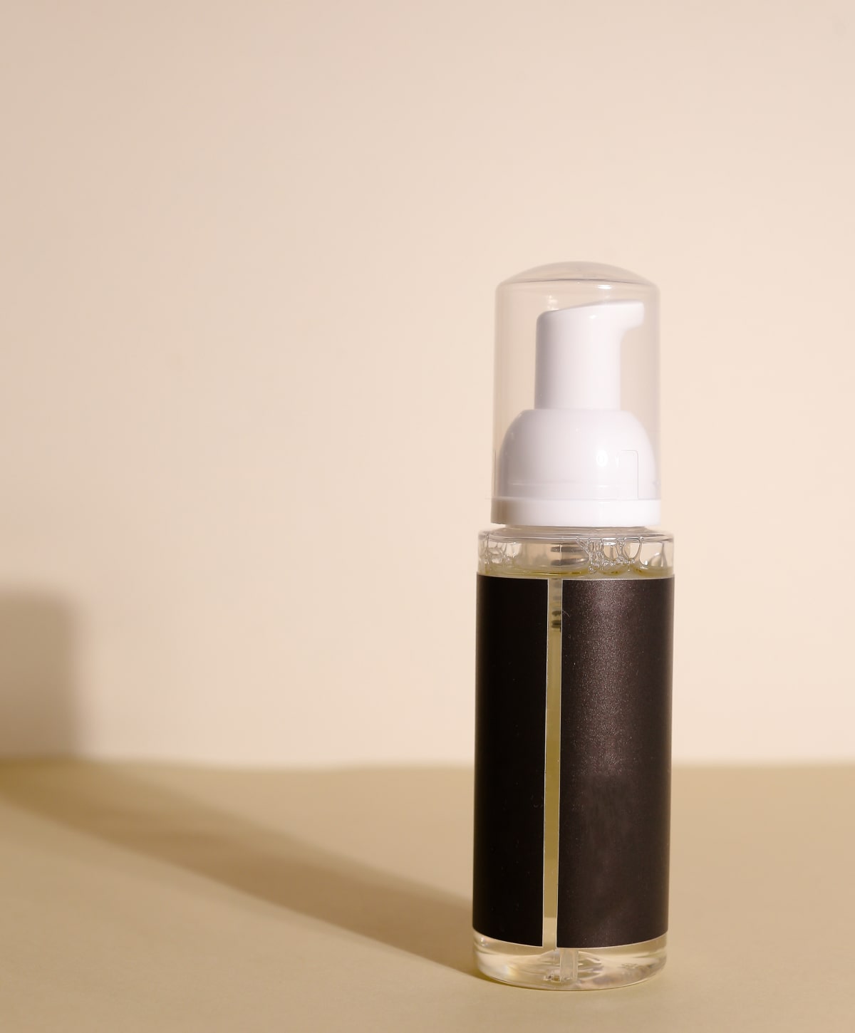 skincare bottle on beige background
